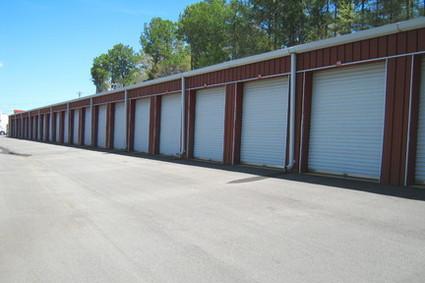 A row of self storage units outside.