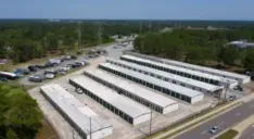 Aerial view of an outdoor storage facility with parking spaces