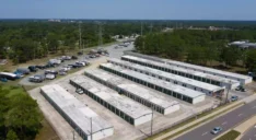 Aerial view of an outdoor storage facility with parking spaces