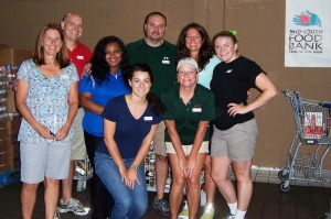 Group of ASM employees volunteering at the food bank.
