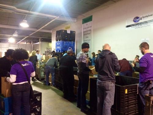 ASM employees working together at a food bank.