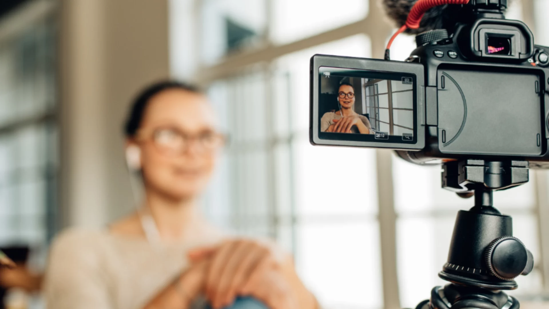 An Absolute Management employee being recorded with a video camera.