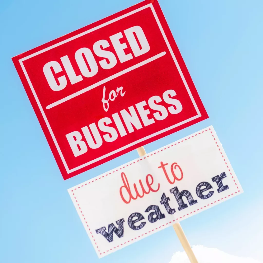 Sign stating "Closed for business due to weather."