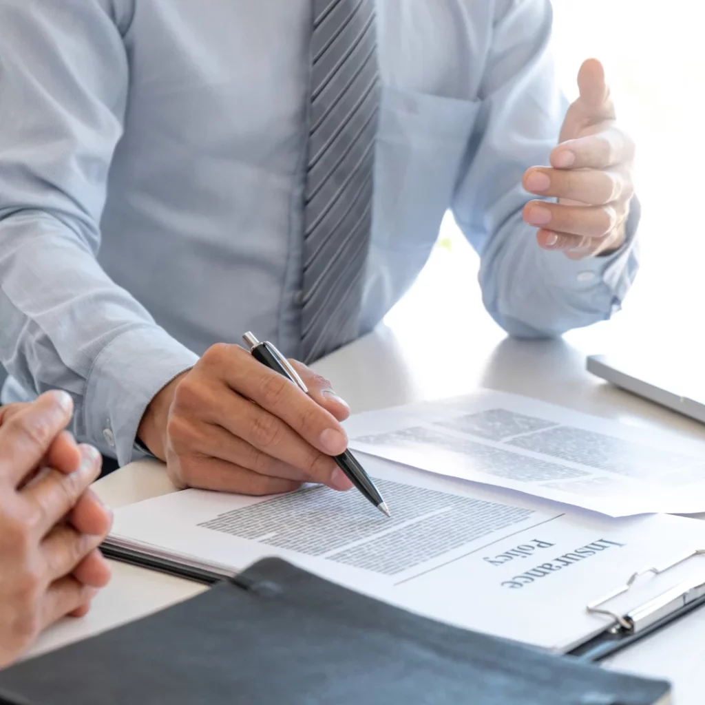 A man signing papers.