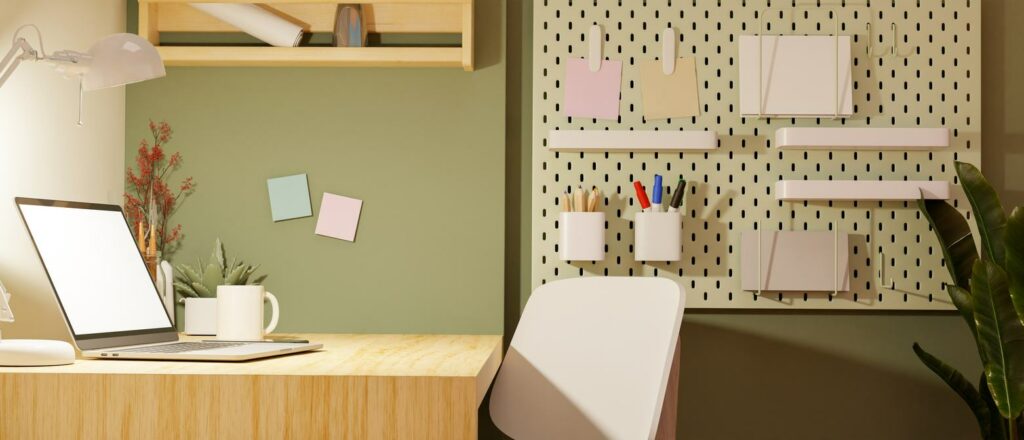 A peg board filled with student essentials hangs on a wall next to a desk