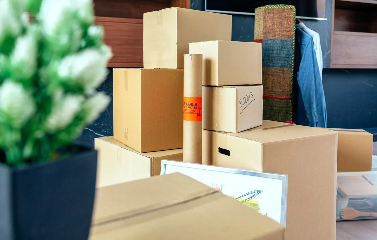 Stacks of cardboards sit neatly outside a storage unit