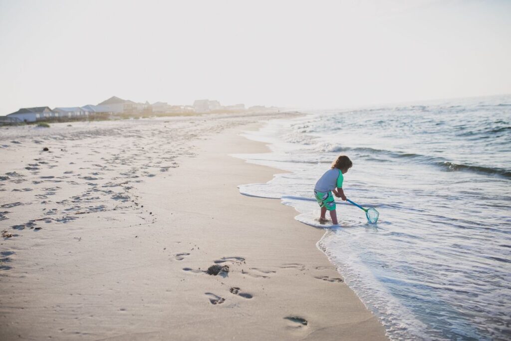 A boy plays in the water at a beach in Gulf Shores.